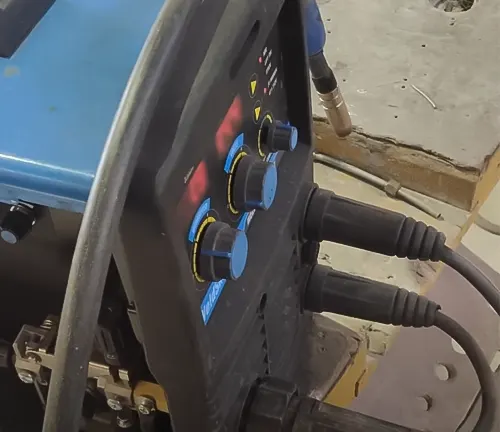 Close-up of a Cigweld Weldskill 3-in-1 Welder’s control panel with knobs and cables