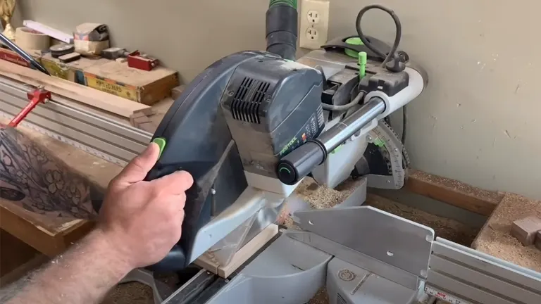 Person making precision cuts for box joint jig on table saw