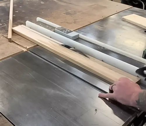 Table saw with precision cut jig in woodworking workshop