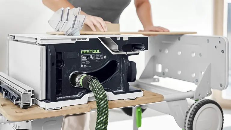 Person operating a Festool Table Saw CSC SYS 50 to cut wood