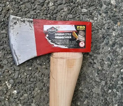 Garant Cougar Axe with a red label on a gravel surface