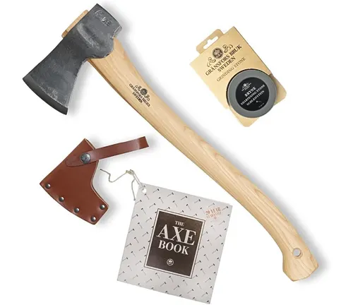 Gransfors Bruk Small Forest Axe with a leather sheath, care oil, and The Axe Book on a white background