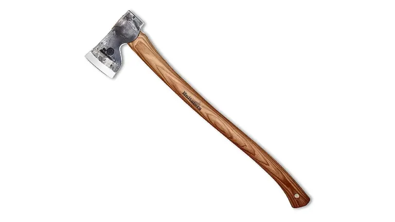 Diagonal view of an axe with a metal head and long wooden handle on a white background