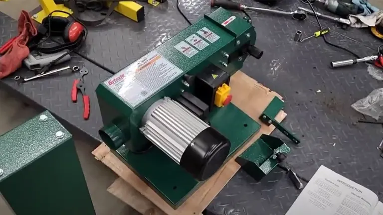 Grizzly 1.5 HP 4" x 36" Belt Sander on a Workbench with Tools