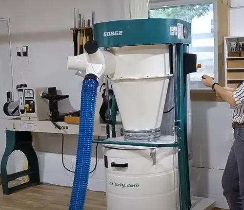 Grizzly G0862 3 HP Portable Cyclone Dust Collector in a well-lit workshop with woodworking tools