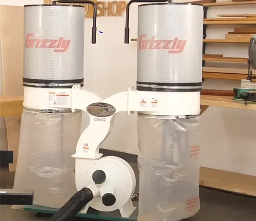Grizzly 3 HP Dust Collector with dual collection bags and aluminum impeller in a well-equipped workshop