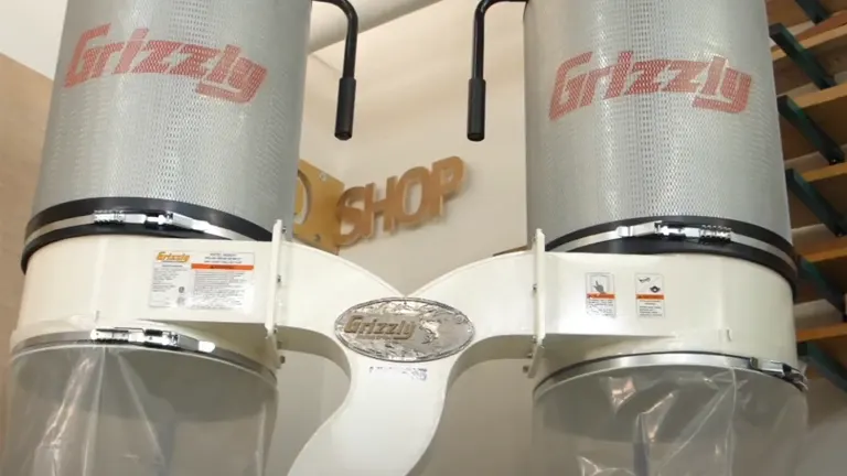 Grizzly 3 HP Dust Collector with Aluminum Impeller and safety instructions in a workshop setting