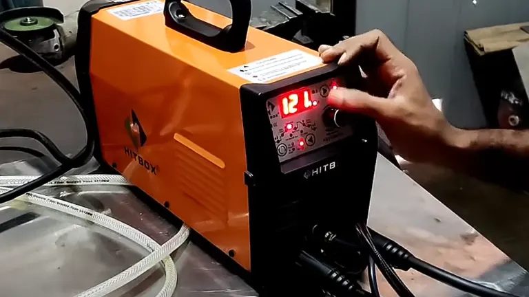 Person adjusting settings on a HBT2000 TIG ARC Welding Machine in an industrial setting