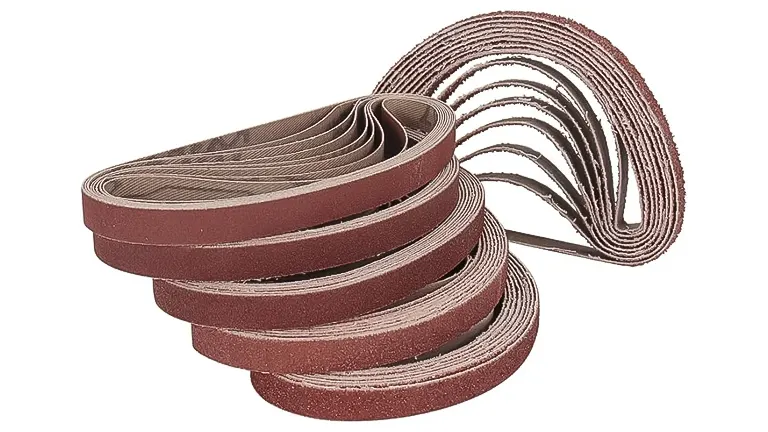 Stack of red sandpaper belts for a belt sander