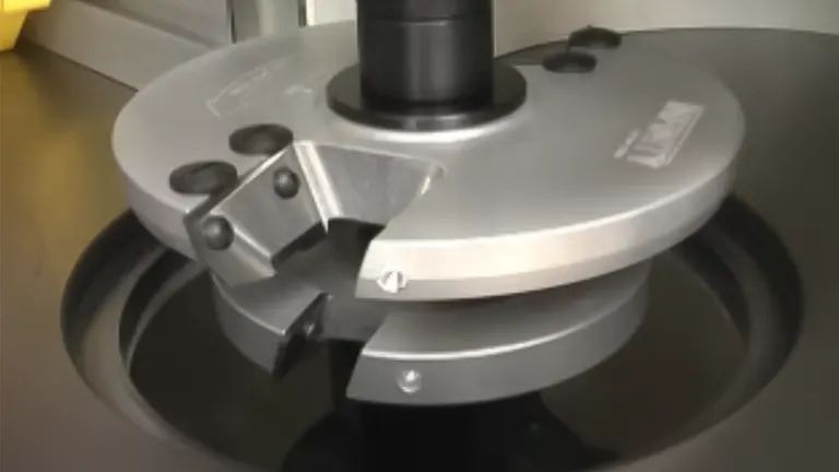 Close-up of the circular metal plate with three silver blades of a JET Shaper JWS-22CS Shaper