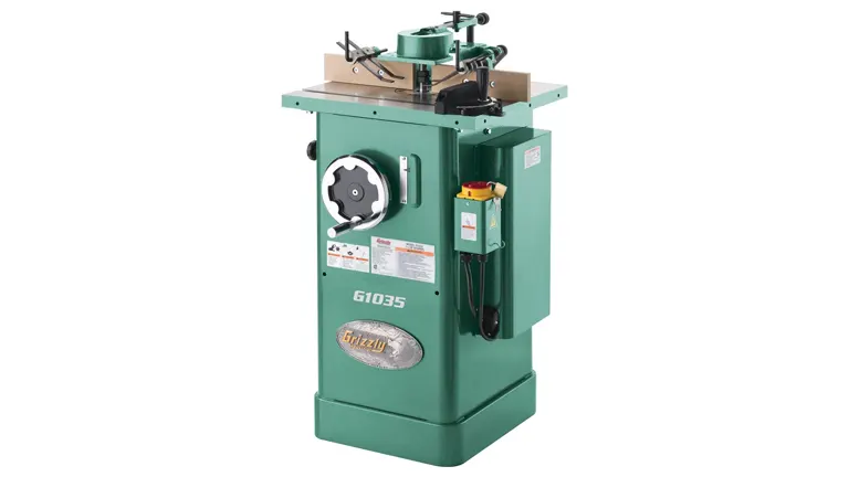 Green Grizzly G1035 Shaper Machine with a silver label and a yellow safety switch