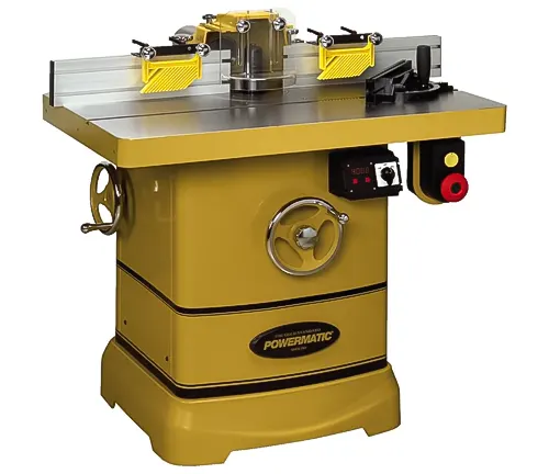 Powermatic 5HP Woodworking Shaper PM2700, a yellow machine with a table top, various adjustment knobs and levers, and a large red emergency stop button