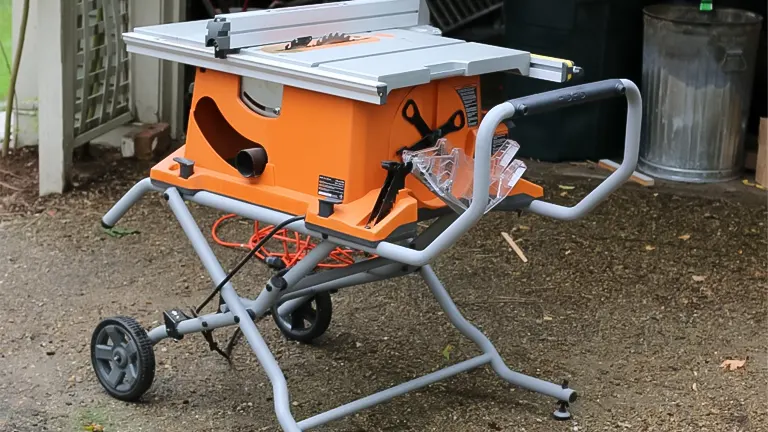 Orange and gray RIDGID 10 Inch Table Saw R4510 on a stand with wheels in a backyard setting