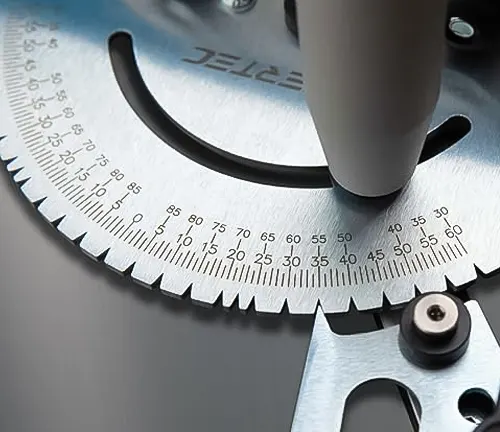 Close up of a table saw blade and angle adjustment guide