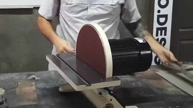 Person using Shop Fox W1828 12-Inch Disc Sander in a workshop