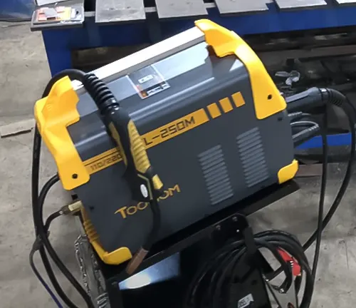 TOOLIOM 200A TIG 2-in-1 Welding Machine, model TL-250M, placed on a blue workbench