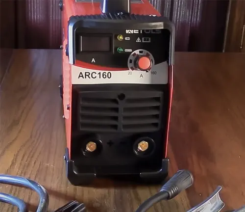 WETOLS 2-IN-1 Stick Welder with Lift TIG, model ARC160, placed on a wooden surface