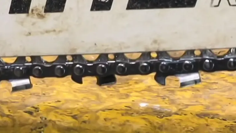 close-up of a chainsaw’s bar and chain over a freshly cut wooden surface, illustrating the importance of bar movement for efficient cutting