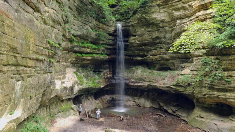 serene waterfall cascading down a layered rock formation at Starved Rock State Park