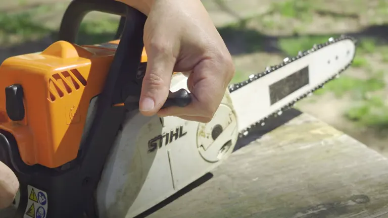 Person’s hand adjusting the throttle on a STIHL chainsaw, illustrating high idle speed