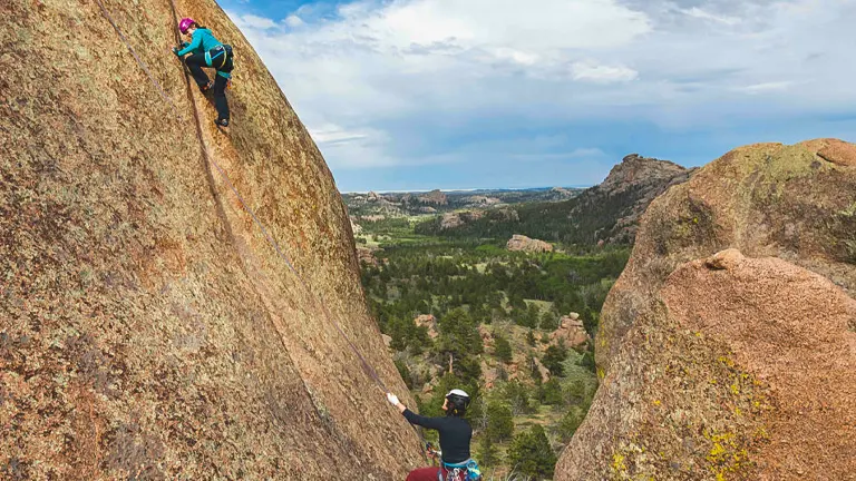 Two climbers ascending a rocky surface at Vedauwoo