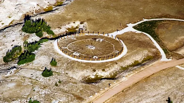 Aerial view of Medicine Wheel National Historic Landmark with paths and surrounding landscape
