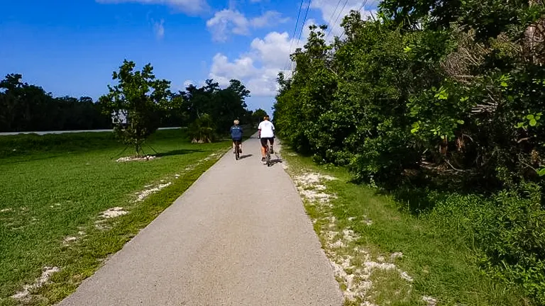 Two people biking on a trail at Fort Zachary Taylor Historic State Park