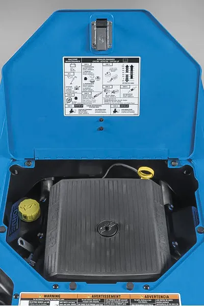 Internal components of a blue machinery with instructional label