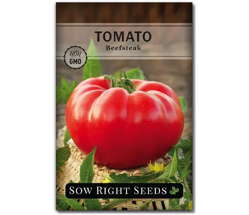 A packet of Beefsteak tomato seeds from Sow Right Seeds with a non-GMO label, featuring an image of a large, ripe red tomato on the front.