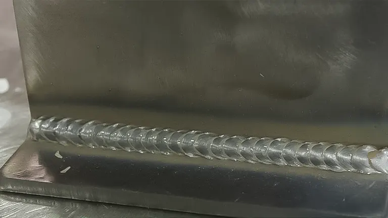 Close-up of a uniform weld bead on metal sheets