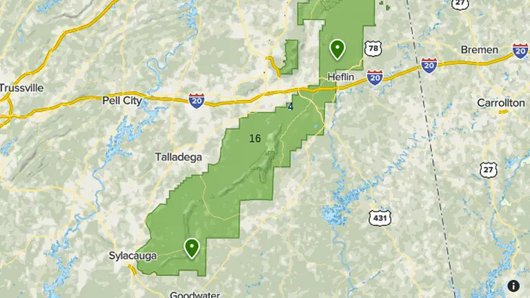 Map showing the geographical outline of Talladega National Forest along Interstate 20 in Alabama, with nearby cities including Talladega, Sylacauga, and Heflin marked by green pins.