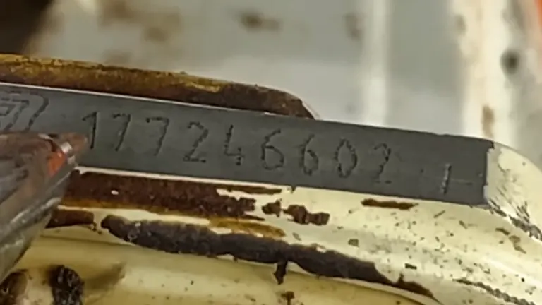 Pen pointing the STIHL Serial Code that mean it is made from Germany