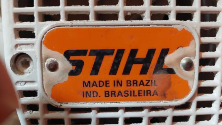 Pen pointing the STIHL Serial Code that mean it is made from Brazil