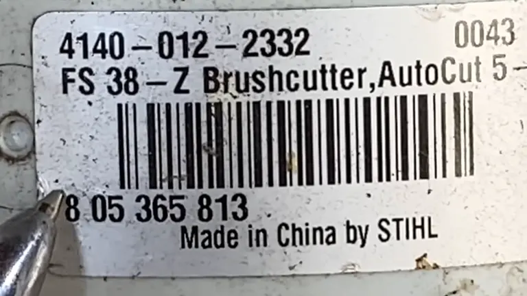 Pen pointing the STIHL Serial Code that mean it is made from China