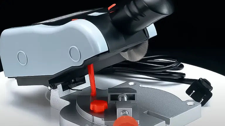 Close-up of a BEAMNOVA Mini Miter Saw highlighting the blade, red safety switch, and power cord