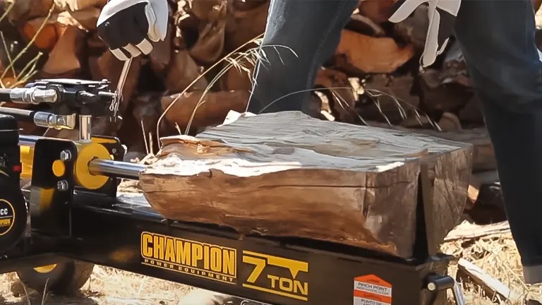 Close-up of a large log positioned on a Champion 90720 7-Ton Gas Log Splitter, ready for splitting