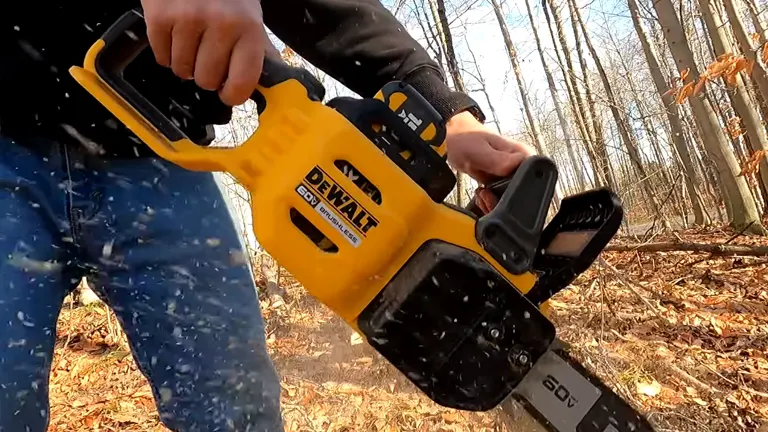 Person with black jacket and blue pants using DEWALT DCCS677Z1 FlexVolt 60V Chainsaw in the woods 