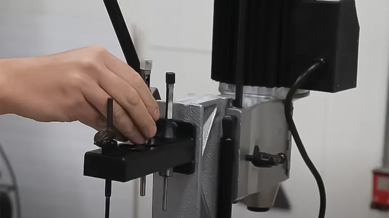Hand adjusting a Delta 1/2 HP Benchtop Mortising Machine