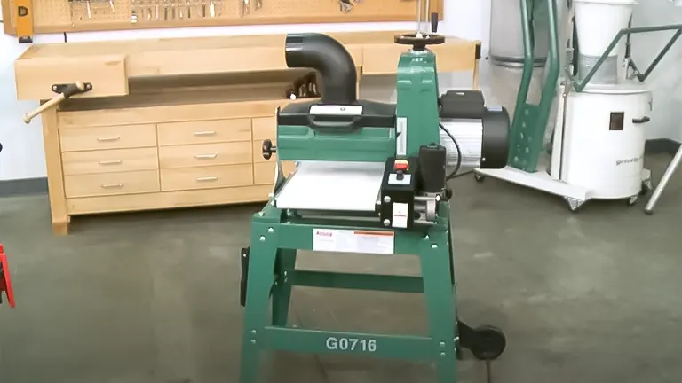 Grizzly G0716 10-inch 1 HP Drum Sander on a stand in a woodworking shop