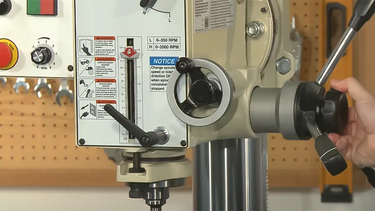 Close-up of a Grizzly G0808 gearhead drill press's head and controls