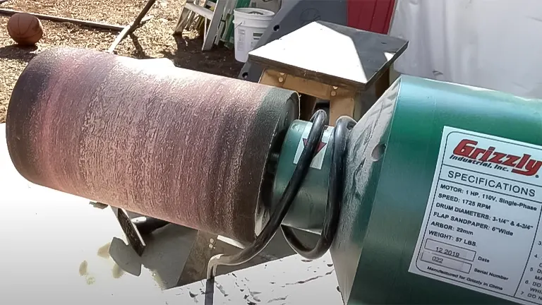 Close-up of the Grizzly G8749 drum sander in operation