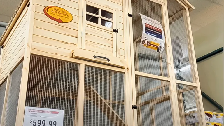 Wooden chicken coop for sale at $599.99, displayed in a store