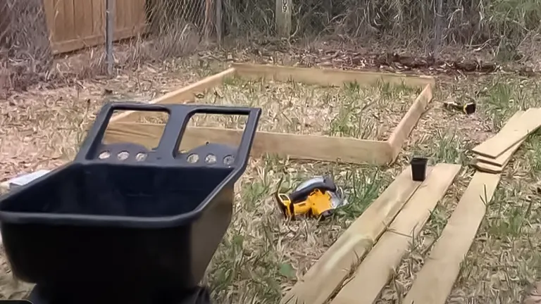 Initial construction setup for an A-frame chicken coop with materials and tools