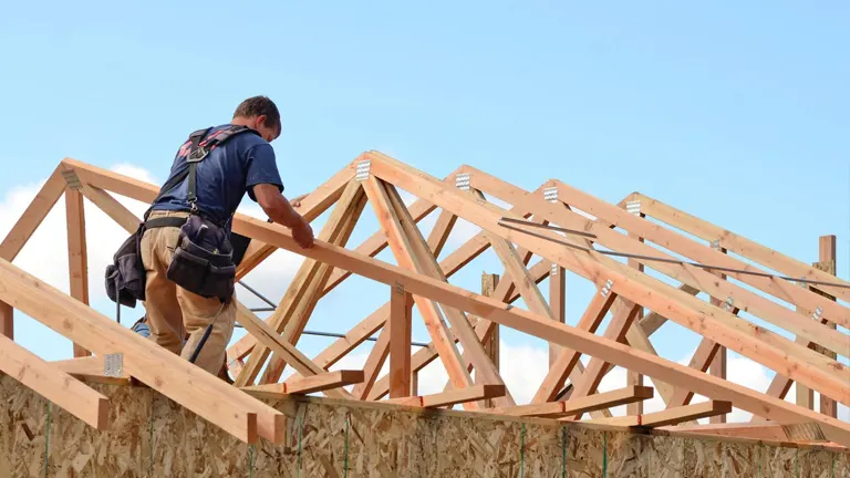 Man making roof trussses