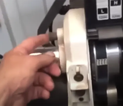 Hand adjusting the tailstock on a JET JWL-1640EVS variable-speed wood lathe