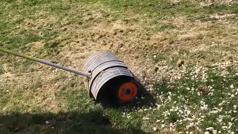 STIHL Rock Sweeper sweeping all the rocks in the grass