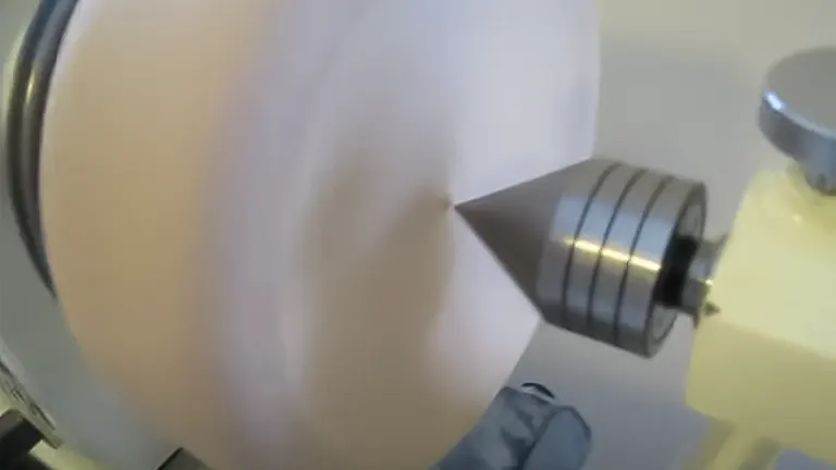 Blurred motion of wood piece turning on a lathe