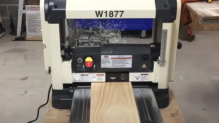 Shop Fox W1877 benchtop planer with wood piece ready for planing
