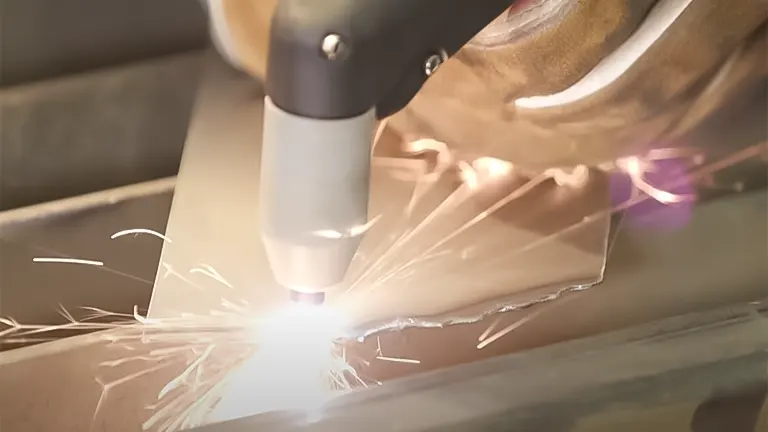 Plasma cutter torch in action cutting metal with sparks