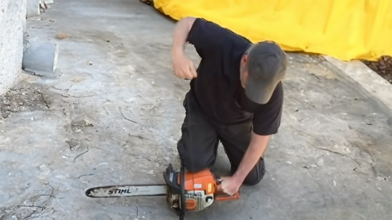 Man starting chainsaw 